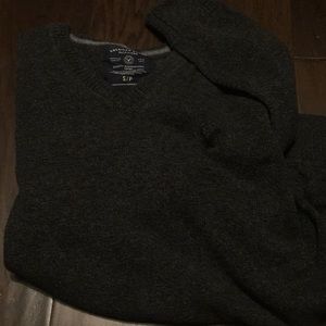 V-neck Men’s sweater. Small spot in back.